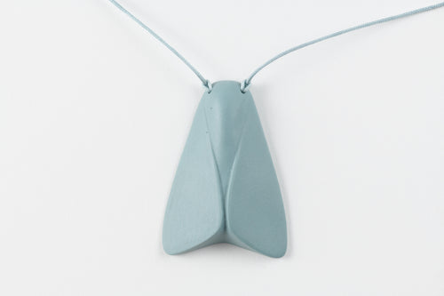 Light blue butterfly-shaped pendant on a thin string against a white background