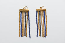 Load image into Gallery viewer, Pair of gold and blue beaded earrings on a light gray background
