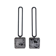 Load image into Gallery viewer, Sandra Salaices Dangling Cube Earrings on Stadium
